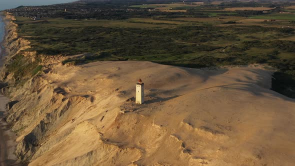 Drone Flight Descending To Rubjerg Knude Lighthouse Hjorring Denmark alt