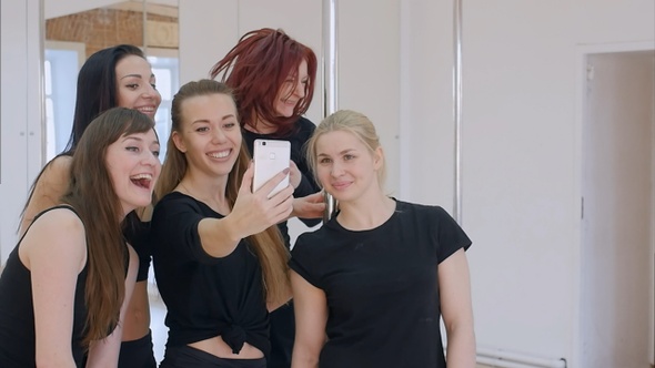 Beautiful young women taking a selfie during a break on