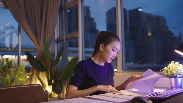 Asian  home working late at night. alt