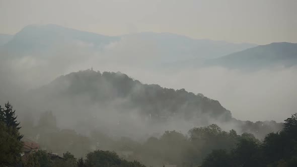Italian Hill Town Cover with Fog Time Lapse alt