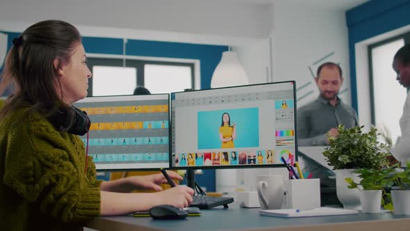 Retoucher Putting on Headset Working on Project Drawing with Stylus Pencil alt