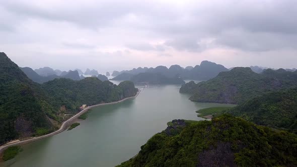 Gia Luan harbor in Cat Ba Island Vietnam with sea entrance of Lan Ha Bay, Aerial flyover shot alt