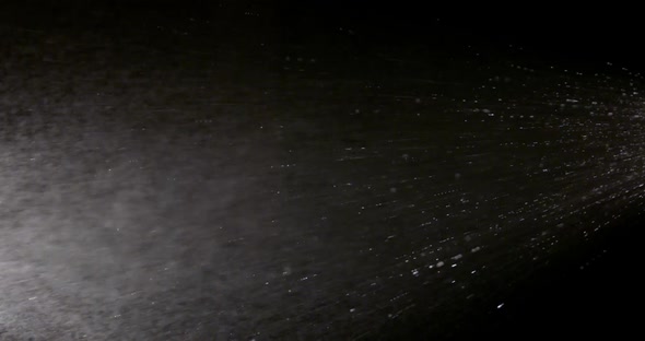 The Effect of Spraying Water on a Black Background Is Suitable To Replace in Your Video alt