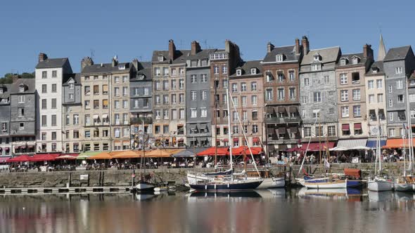 HONFLEUR, FRANCE - SEPTEMBER 2016 Slow pan on The Vieux Bassin port  by the day with colorful facade alt