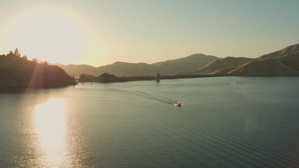 Aerial Drone Tracking Shot of a Boat Wakeboarder and  Jet Skis on a Lake (Lake Kaweah, Visalia, CA)