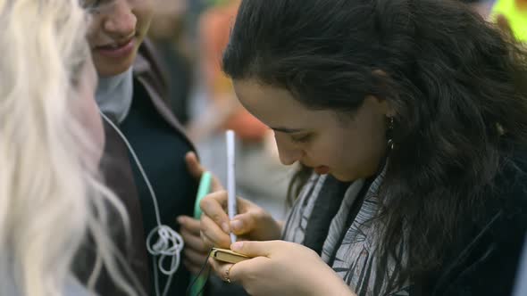 Woman Write Note Phone Number in Little Notebook Paper and Give It to Friends Students Irrl alt