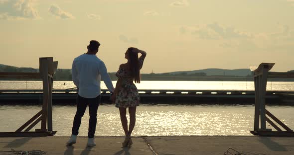 Romantic Couple Having Date on Embankment at Sunset