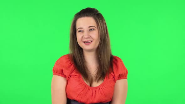 Portrait of Confused Girl Saying Oops and Shruging. Green Screen alt