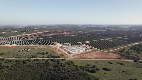Panoramic aerial pan reveals massive solar farm, sustainable resource