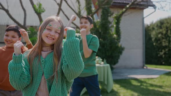 Children Having Fun Dancing at a Backyard Birthday Party on a Sunny Day alt