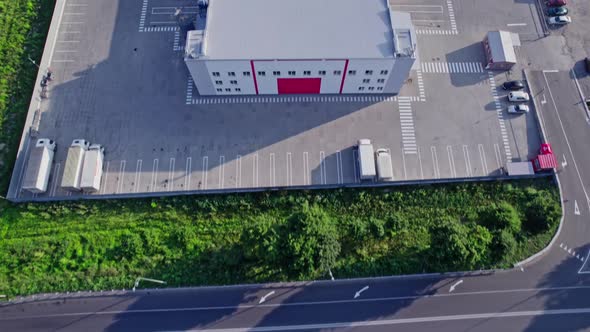 Semitrucks with Freight Trailers Standing at the Ramps alt
