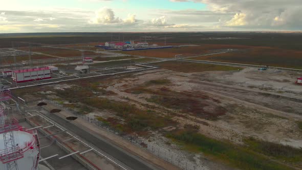 There are White Clouds in the Sky with a Pinkishyellowish Tint alt