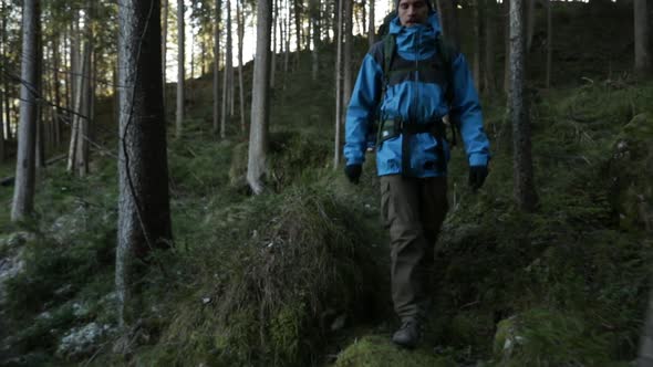 Slow motion shot of two friends hiking in the forest, Bavaria, Germany alt