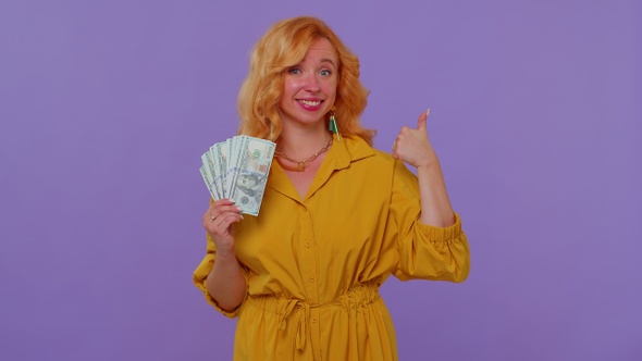 Proud Arrogant Rich Stylish Girl Holding Money Cash in Dollars Banknotes Smiling Looking at Camera alt