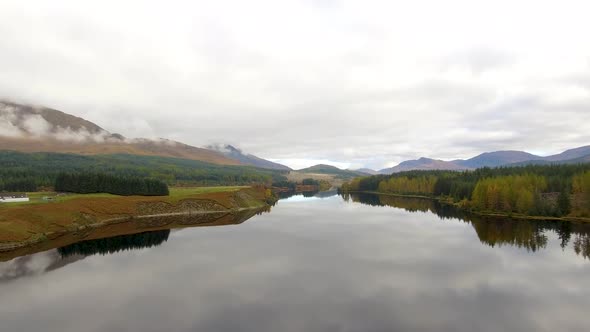 Aerial view of Laggan dam artificial lake and beautiful countryside and wood