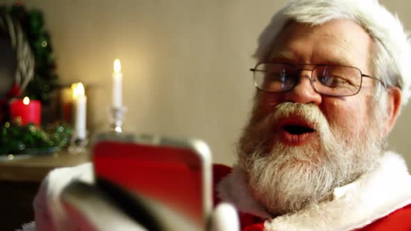 Santa Claus Using Mobile Phone alt