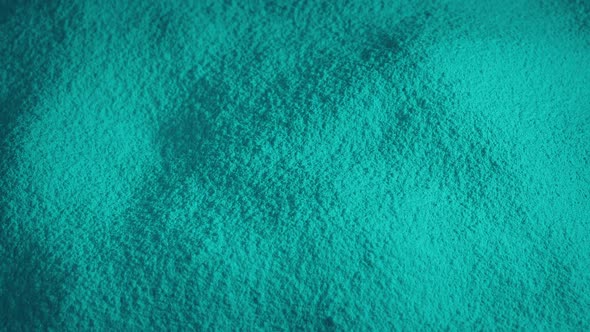 Light Blue Powder Material Rotating Slowly alt