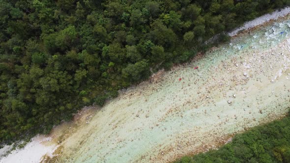 Aerial view of kayakers in the river Soca in Slovenia.