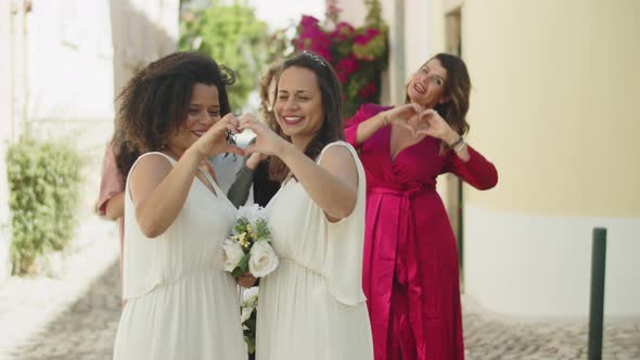 Brides Having Photoshoot with Friends After Wedding Ceremony alt