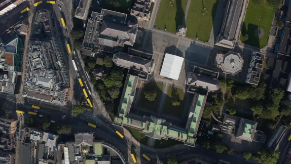 Aerial Birds Eye Overhead Top Down Panning View of Streets Blocked By Yellow Town Buses alt