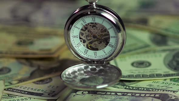 Watch and Money Closeup, the Pendulum of Fate. Importance of Time Over Finances alt
