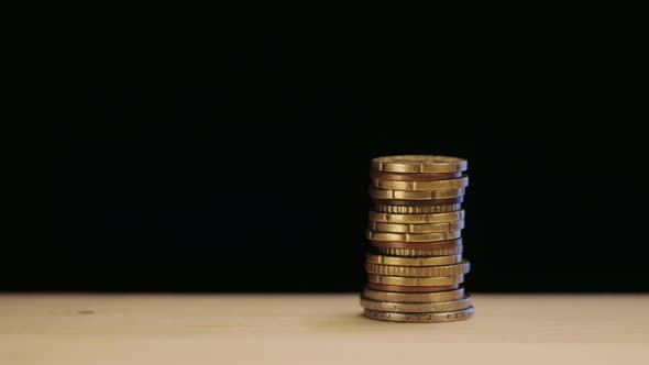 A man trying to catch a coin