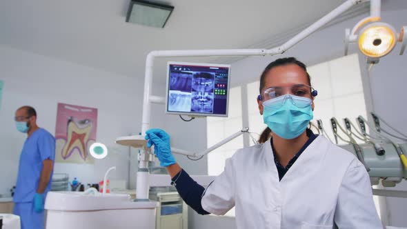 Doctor Measuring Woman Temperature Before Dental Examination alt