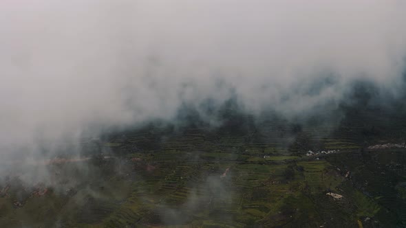 drone shot through clouds in Canyon del Colca in Peru