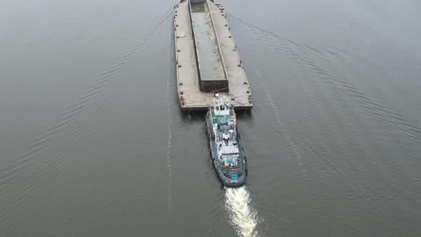 The Barge Floats on the River