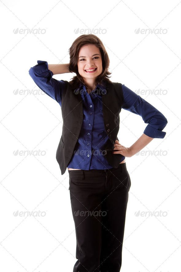 Young business woman standing smiling - Stock Photo - Images