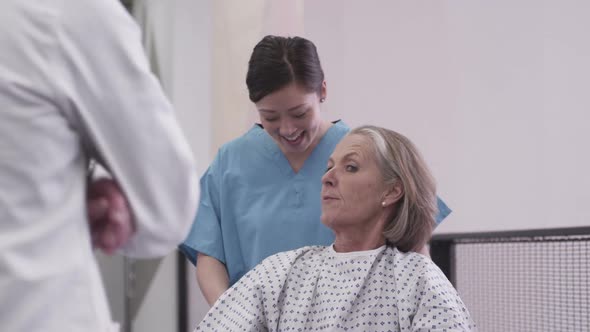 MS Doctor and nurse talking with patient in hospital / London, Greater London, United Kingdom.