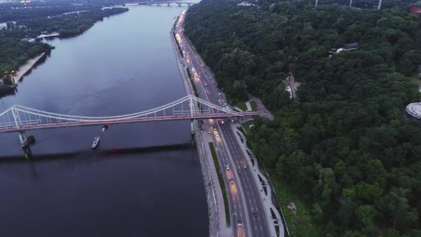 Aerial View of the Pedestrian Bridge Over the Dnieper River in the Evening