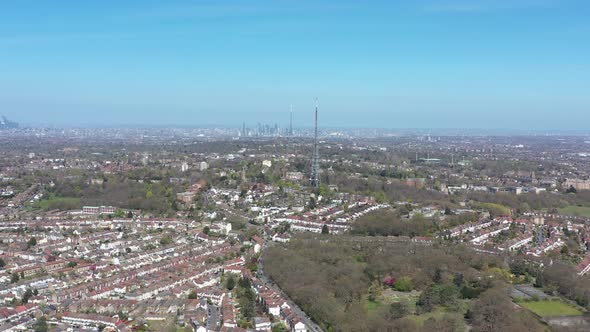 High dolly forward drone shot of two antenna in south London Crystal palace tower radio alt