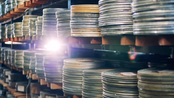 Old Metal Cases with Tape Movies Stocked on the Shelves alt