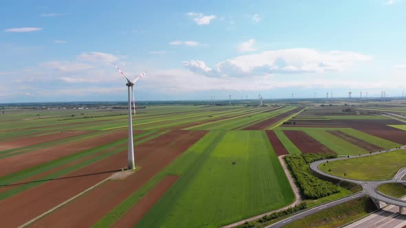 Aerial View of Wind Turbines Farm and Agricultural Fields. Austria alt