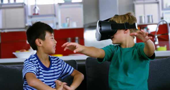 Siblings using virtual reality headset alt