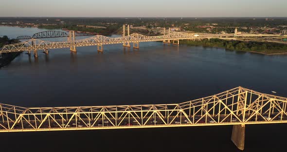 Bridge in Louisville, Kentucky over Ohio River with drone video moving back. alt