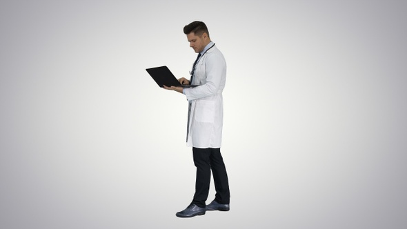 Man wearing white medical coat and stethoscope walking alt