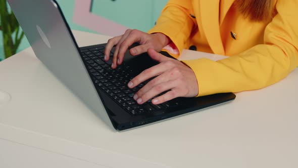 Woman Is Typing on Laptop