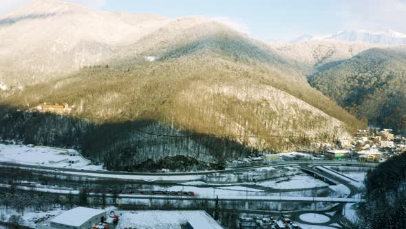 Beautiful footage of aerial Drone  view of train in winter forest mountains