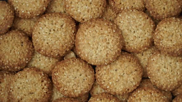 Top View of Fresh Baked Sweet Cookies with Sesame Rotate on Tray