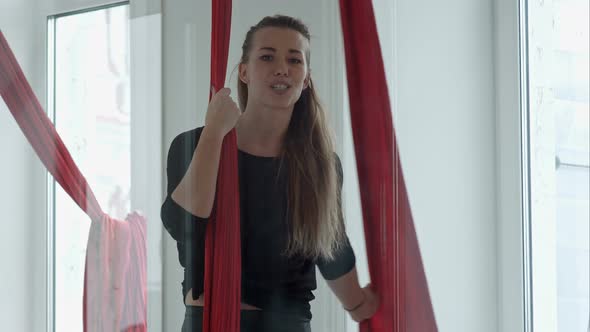 Happy Smiling Pole Dancer Talking To a Camera alt