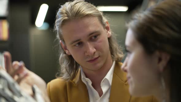 Couple are communicating in library Bionics Cybernetic Robotic-arm Hand prosthesis alt