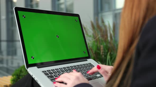 Women Hands Working on Laptop Green Screen alt