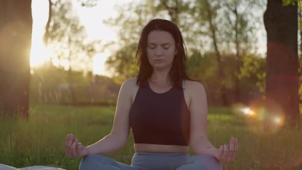 Girl Meditates in Nature in the Park alt