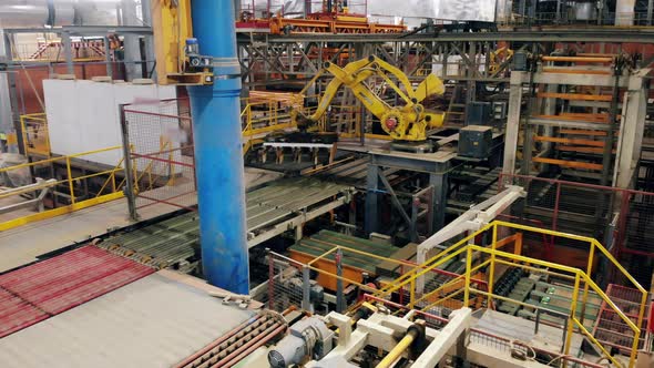 Modern Industrial Robotic Arm at the Brick-producing Factory alt
