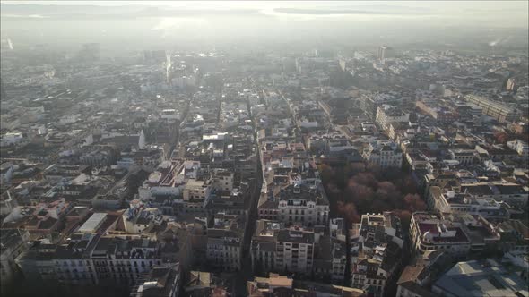 Drone flying over Granada historical town center and Cathedral, Spain. Aerial backward