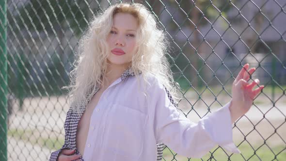 Close-up portrait of nice-looking multi-race, beautiful, sexy, young woman looking into camera alt