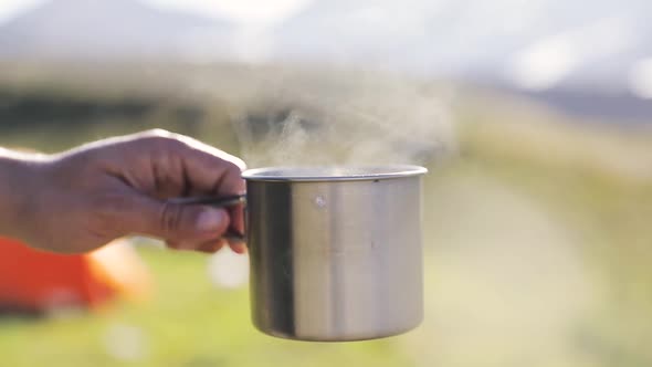 Coffee Cup with Steam at Nature Outdoor alt
