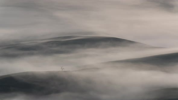 Time lapse of the fog over the vlley in Toscana